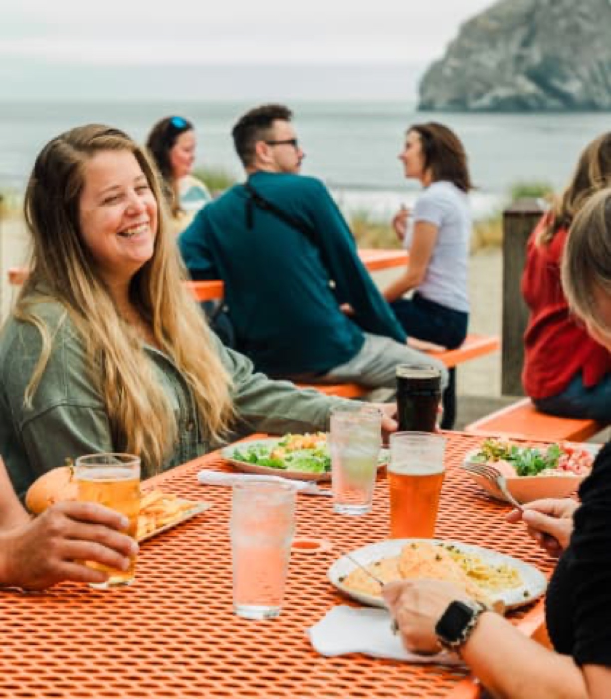 Outdoor dining at Pelican Brewing in Pacific City with Haystack Rock in the background